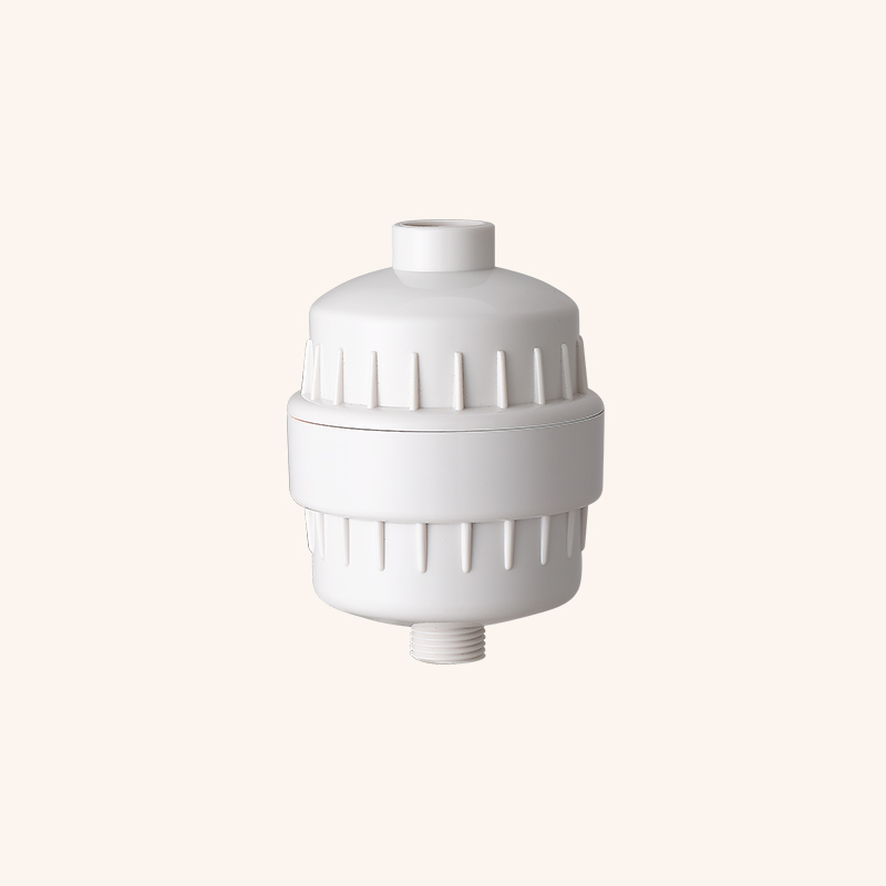 White plastic cylindrical valve/pipe fitting with ribbed surface and two threaded ends (top cap and bottom male thread) shown against a light beige background
