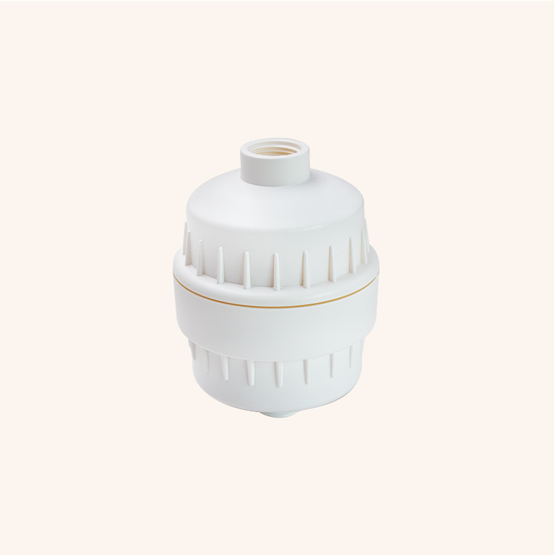 White plastic inline water filter housing with a screw-on top cap and ribbed body.